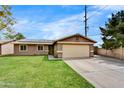 Inviting single-Gathering home with a well-maintained lawn and attached two-car garage at 18601 N 45Th Dr, Glendale, AZ 85308