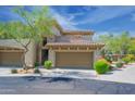 Charming condo with tile roof, two car garage, and beautiful desert landscaping at 19700 N 76Th St # 2091, Scottsdale, AZ 85255