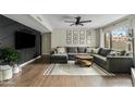 Comfortable living room with a large gray sectional sofa, modern decor, and abundant natural light at 2026 S Emerson --, Mesa, AZ 85210
