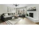 Inviting living room featuring a large sectional sofa, fireplace, and bright ambiance at 2026 S Emerson --, Mesa, AZ 85210