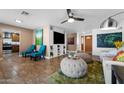 Spacious living room featuring tile floors, modern decor, and an open layout perfect for entertaining at 2218 W Curry St, Chandler, AZ 85224