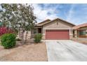 Single-story home featuring a two-car garage and desert landscaping in Arizona at 24868 W Kowalsky Ln, Buckeye, AZ 85326