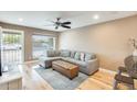 Inviting living room with comfortable seating, hardwood floors, and natural light at 3149 W Danbury Dr, Phoenix, AZ 85053
