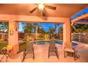 Outdoor patio with decorative touches overlooking the pool and backyard, perfect for relaxation at 3270 W White Canyon Rd, San Tan Valley, AZ 85144