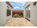 Private outdoor patio with tiled flooring, perfect for relaxation and enjoying the desert ambiance at 32771 N 70Th St, Scottsdale, AZ 85266