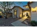 Welcoming front exterior with desert landscaping and a decorative wreath on the front door at 3610 W Plymouth Dr, Anthem, AZ 85086