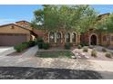 Exterior home showcasing stone accents, a tiled roof, and well-maintained landscaping at 4777 S Fulton Ranch Blvd # 1050, Chandler, AZ 85248