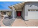 Inviting front entrance with a red door and a covered porch at 514 E Barrus Pl, Casa Grande, AZ 85122