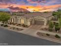 An aerial view showcases the home's landscaping, tiled roof, and three-car garage in a desirable location at 10510 E Sanger Ave, Mesa, AZ 85212