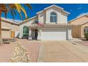 Charming home features a two-car garage, desert landscaping, and a well-maintained exterior at 15809 N 11Th Ave, Phoenix, AZ 85023