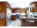 Well-equipped kitchen with stainless steel appliances and ample cabinet space at 3907 E Marilyn Rd, Phoenix, AZ 85032