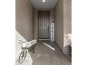 Inviting front entryway with a decorative bicycle accent and a welcoming 'Home' sign to greet visitors at 11148 E Tumbleweed Ave, Mesa, AZ 85212