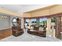 Cozy living room with large windows offering natural light and neutral carpet flooring at 1313 W Glenmere Dr, Chandler, AZ 85224