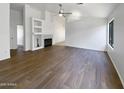Spacious living room with hardwood floors and fireplace perfect for entertaining at 1488 W Page Ave, Gilbert, AZ 85233