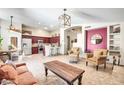 Open-concept living space with tile flooring, modern lighting, and an inviting seating area at 15009 S 47Th St, Phoenix, AZ 85044