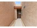 Inviting walkway leads to the front entrance, featuring desert landscaping and a shaded entryway at 1650 S Crismon Rd # 6, Mesa, AZ 85209