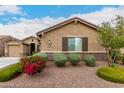 Charming home exterior featuring desert landscaping and an address marker at 18368 W Long Lake Rd, Goodyear, AZ 85338