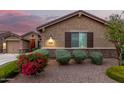 Charming home exterior featuring desert landscaping and an address marker at 18368 W Long Lake Rd, Goodyear, AZ 85338