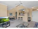 Open-concept living area with neutral walls, a dining table, breakfast bar, and views of the entry door at 20100 N 78Th Pl # 2203, Scottsdale, AZ 85255