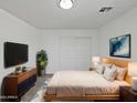 Cozy bedroom featuring neutral colors, soft lighting, and modern decor at 217 E Gwen St, Phoenix, AZ 85042