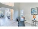 Open concept living space showcasing office, kitchen, and living room areas at 255 S Kyrene Rd # 212, Chandler, AZ 85226