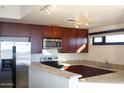 Modern kitchen with stainless steel appliances, dark cabinets and granite counter tops at 310 S 4Th St # 901, Phoenix, AZ 85004