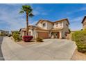 Spacious two-story home boasts a paved driveway and desert landscaping at 6626 W Laurel Ave, Glendale, AZ 85304
