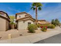 Street view of home with desert landscaping, mature trees and a neutral stucco exterior at 6626 W Laurel Ave, Glendale, AZ 85304