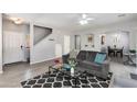 Inviting living room with hardwood floors, modern furniture, and lots of light at 6626 W Laurel Ave, Glendale, AZ 85304
