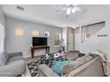 Bright and open living area with stylish decor, hardwood floors, and modern furniture at 6626 W Laurel Ave, Glendale, AZ 85304