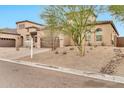 Beautiful two-story home featuring desert landscaping, a paved driveway, and an attached two-car garage at 17913 W Sunward Dr, Goodyear, AZ 85338