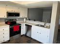 Updated kitchen with stainless steel appliances, white cabinets, and marble countertops at 19601 N 7Th N St # 1032, Phoenix, AZ 85024