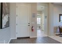 Elegant entryway featuring neutral walls, decorative tile flooring, and recessed lighting at 20445 W Rovey Ave, Buckeye, AZ 85396