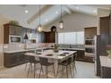 Spacious kitchen featuring a large center island, modern appliances, and ample cabinetry at 20445 W Rovey Ave, Buckeye, AZ 85396