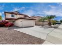 Charming two-story home featuring a red tile roof and spacious two-car garage at 22787 W Gardenia Dr, Buckeye, AZ 85326
