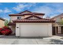 Charming two-story home featuring a red tile roof and spacious two-car garage at 22787 W Gardenia Dr, Buckeye, AZ 85326