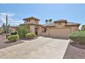 Beautiful stucco home with a tile roof, desert landscaping, and a stamped concrete driveway at 2862 N 156Th Dr, Goodyear, AZ 85395