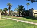 Well-maintained lawn and landscaping add to the charm of this community with a shared pool at 4828 W Rancho Dr, Glendale, AZ 85301