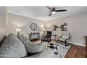 Cozy living room featuring a comfortable sofa, ceiling fan, and stylish décor at 5632 S Hurricane Ct # C, Tempe, AZ 85283