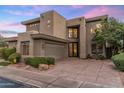 Modern two-story house showcasing its unique architecture and well-maintained front yard at 6929 E Montreal Pl, Scottsdale, AZ 85254