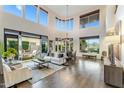 Open-concept living room with hardwood floors, high ceilings, and an abundance of natural light at 6929 E Montreal Pl, Scottsdale, AZ 85254