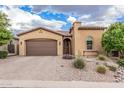Well-maintained home features a desert landscape, a paver driveway, and a charming arched front door at 10713 N 124Th Pl, Scottsdale, AZ 85259