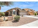 Inviting single-story home with desert landscaping and a two-car garage at 11351 N 153Rd Dr, Surprise, AZ 85379