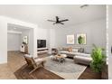 Bright living room with neutral tones, stylish decor, and a comfortable sectional sofa at 15656 W Devonshire Ave, Goodyear, AZ 85395