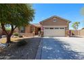 Charming single-Gathering home featuring a well-manicured yard and a two-car garage at 16511 W Cortez St, Surprise, AZ 85388