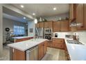 Well-lit kitchen with stainless steel appliances, white countertops, and lots of cabinet space at 19475 N Grayhawk Dr # 1046, Scottsdale, AZ 85255