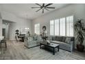 Spacious living room with large windows, stylish furniture and an open floor plan at 19475 N Grayhawk Dr # 1046, Scottsdale, AZ 85255