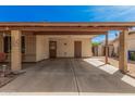 Covered parking area with brick columns leading to front door at 20053 N 15Th Dr, Phoenix, AZ 85027
