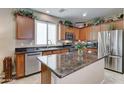 Well-equipped kitchen boasts granite countertops, stainless steel appliances, and ample cabinet space at 3455 E Oakland St, Gilbert, AZ 85295