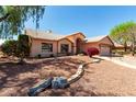 Inviting single-Gathering home featuring desert landscaping and a decorative stone walkway at 4010 N 156Th Ln, Goodyear, AZ 85395